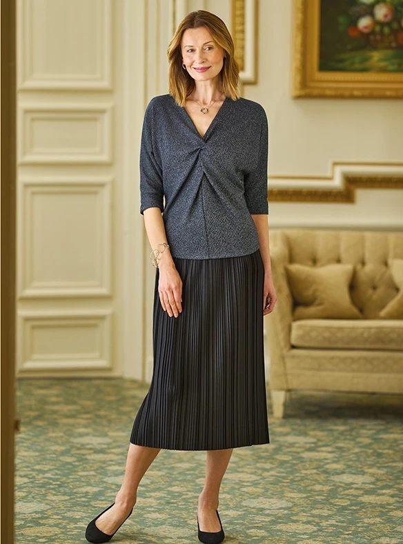 Blouse étincelante à manches chauve-souris